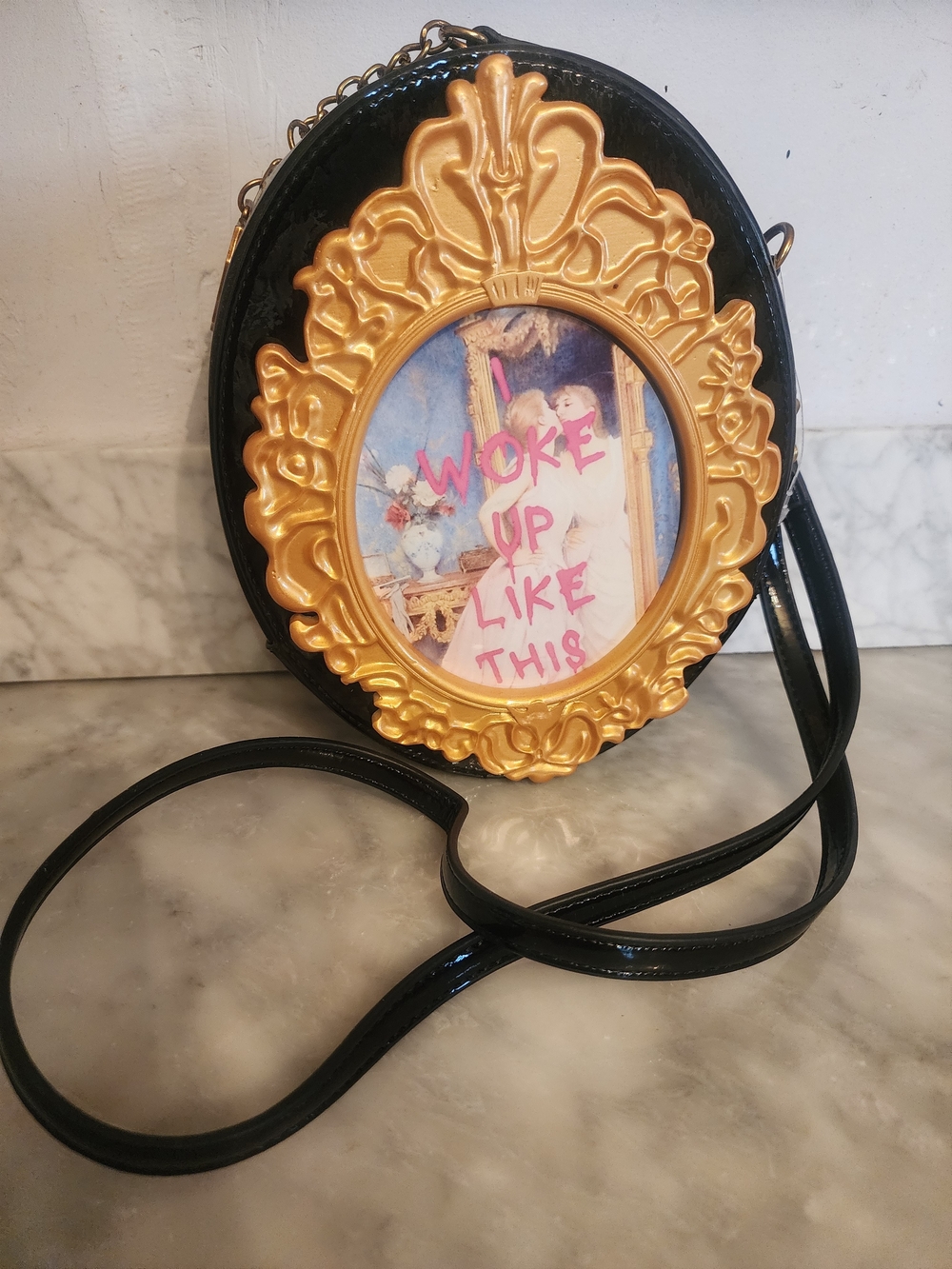 Betsey Johnson Black Oval Crossbody Bag with Gold Frame Accent